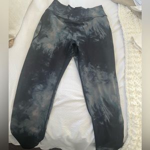 Lightly worn Alphalete Surface Power Legging in black oil stain, Cross Waist